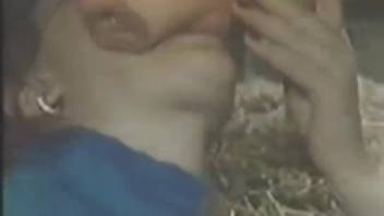 Masked seductress performs fellatio on a stud's rigid member
